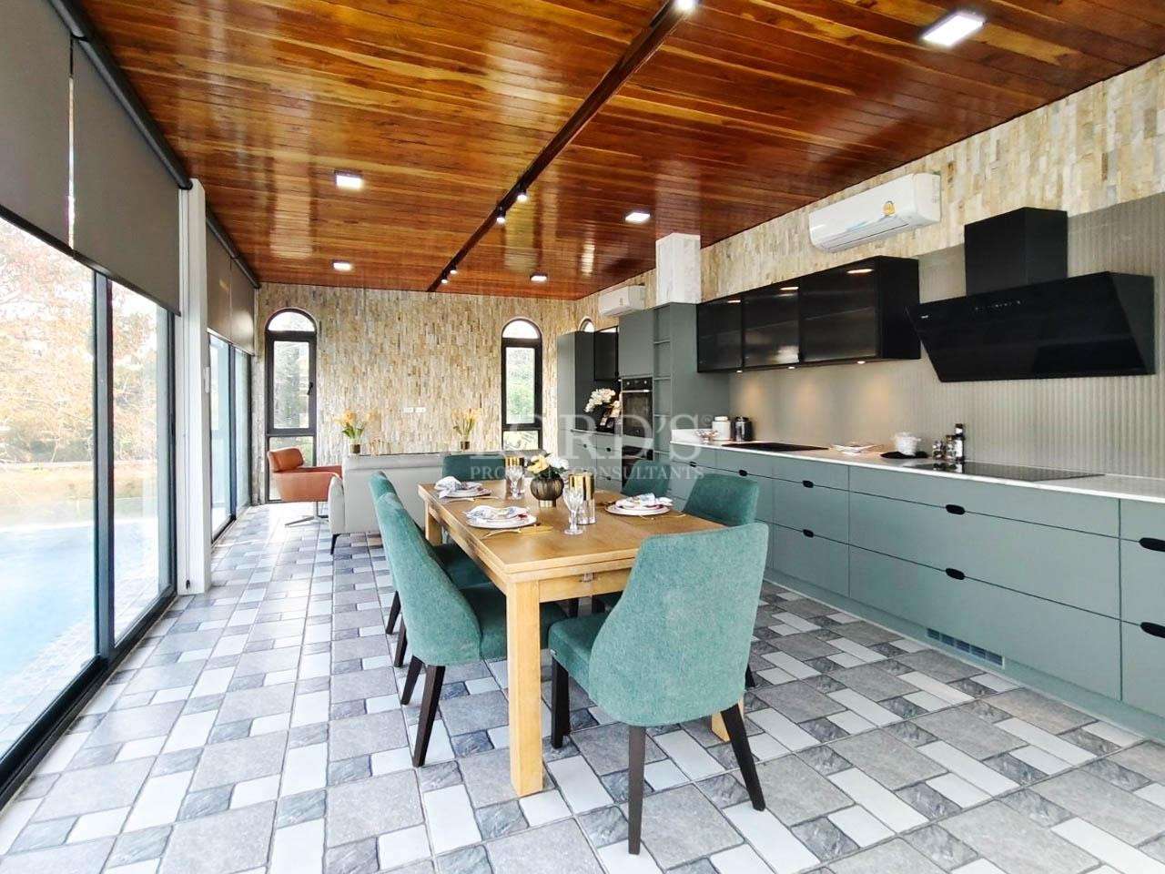 Kitchen with modern cabinets and dining table