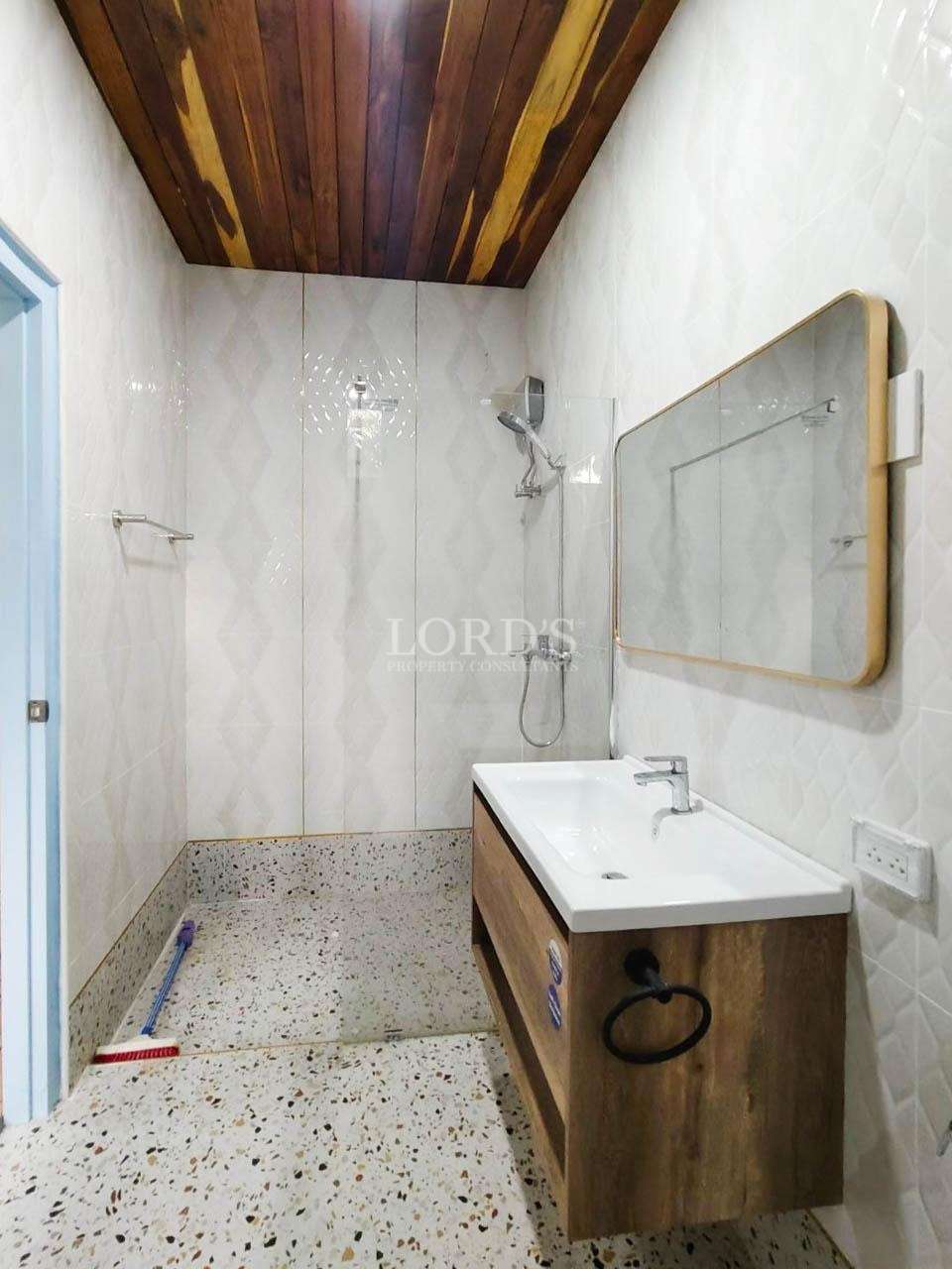 Bathroom with shower and vanity
