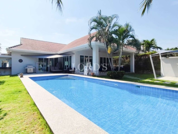 Modern villa exterior with long rectangular pool