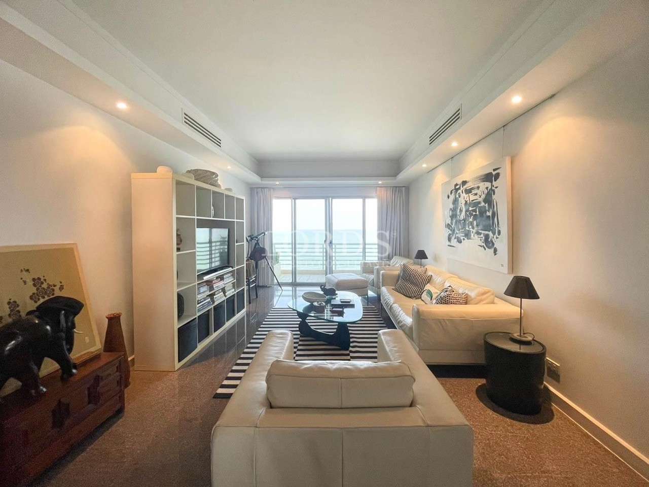 Bright living room with sofa and open layout