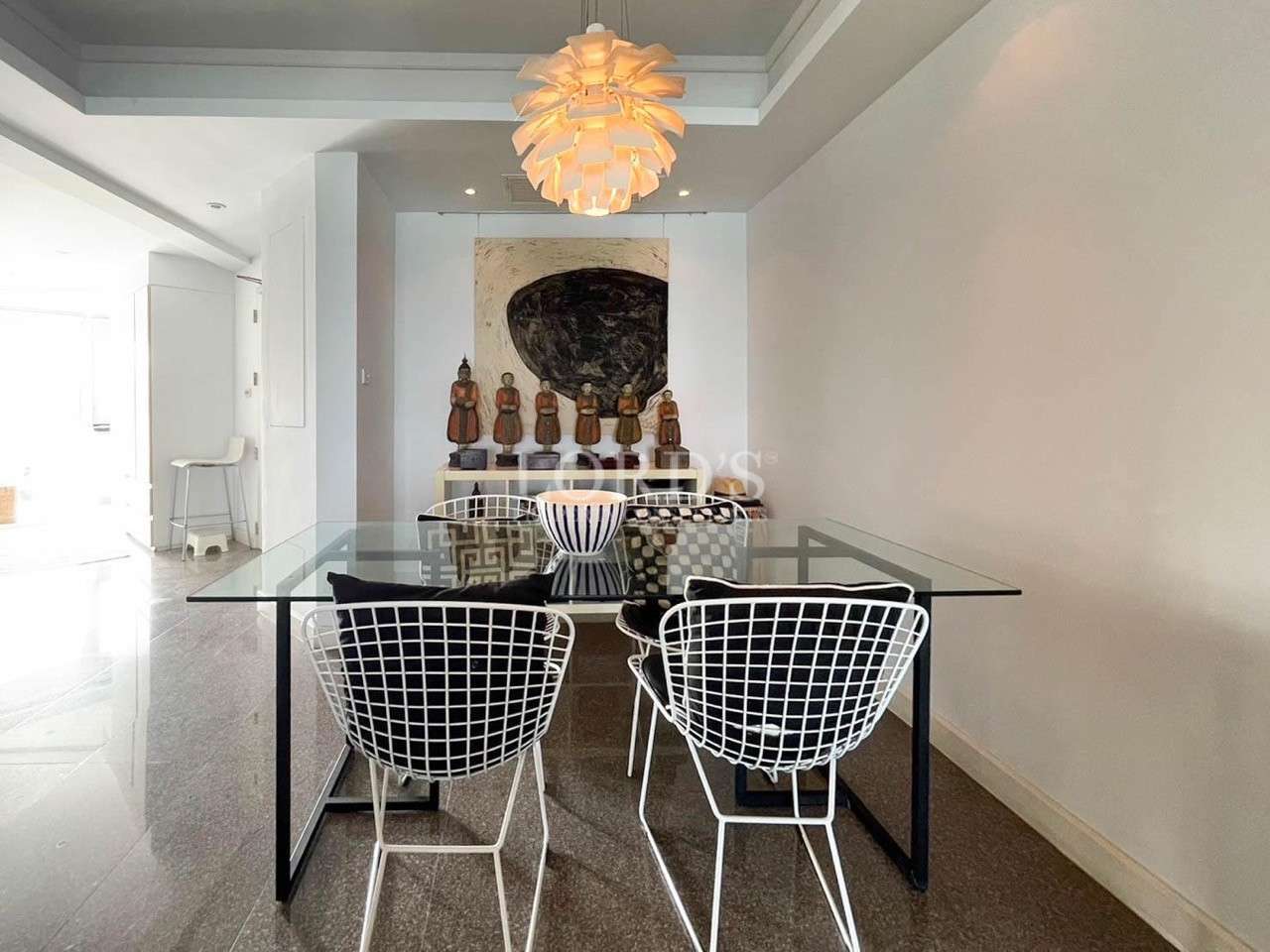Dining area with chandelier and modern decor