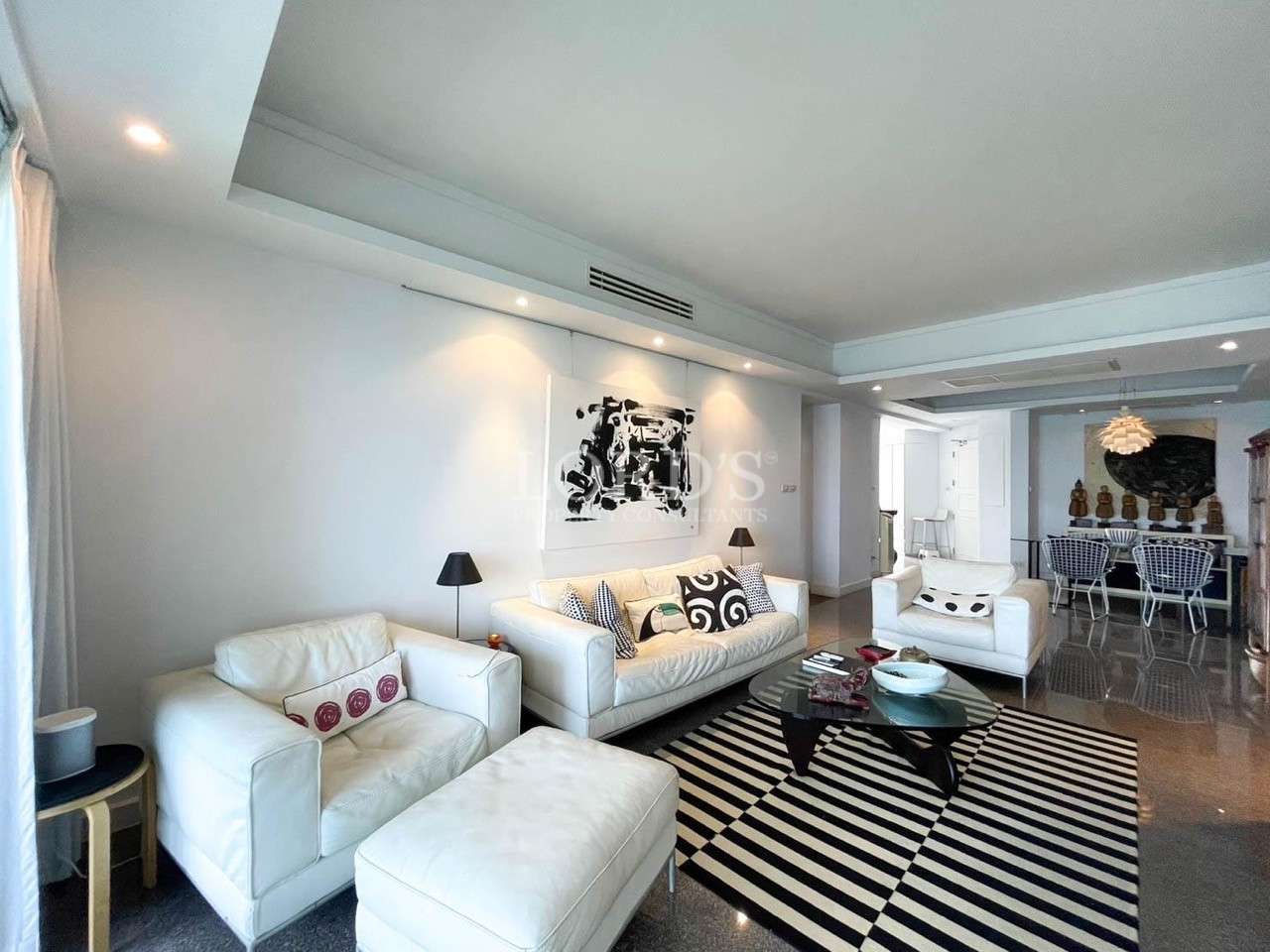 Bright living room with large window and sofa