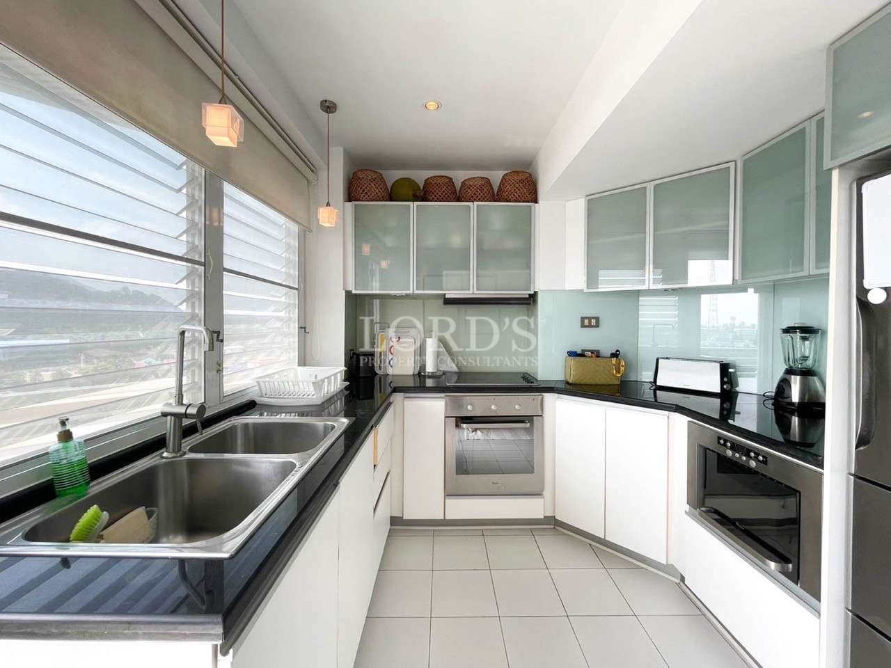Bright kitchen with window and storage cabinets