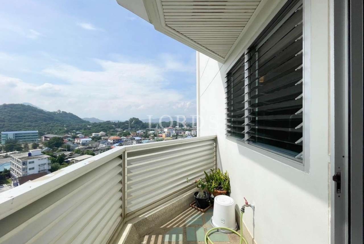 Long balcony corridor with railing and view