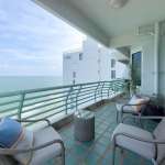 Modern balcony with seating and sea view