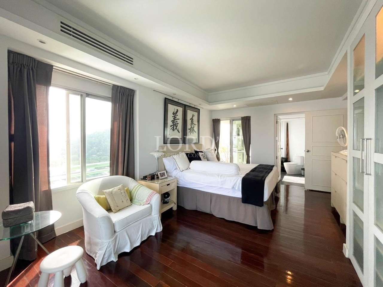 Modern bedroom with large window and decor