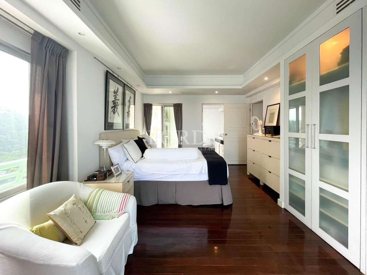 Bedroom with large space and wooden floor