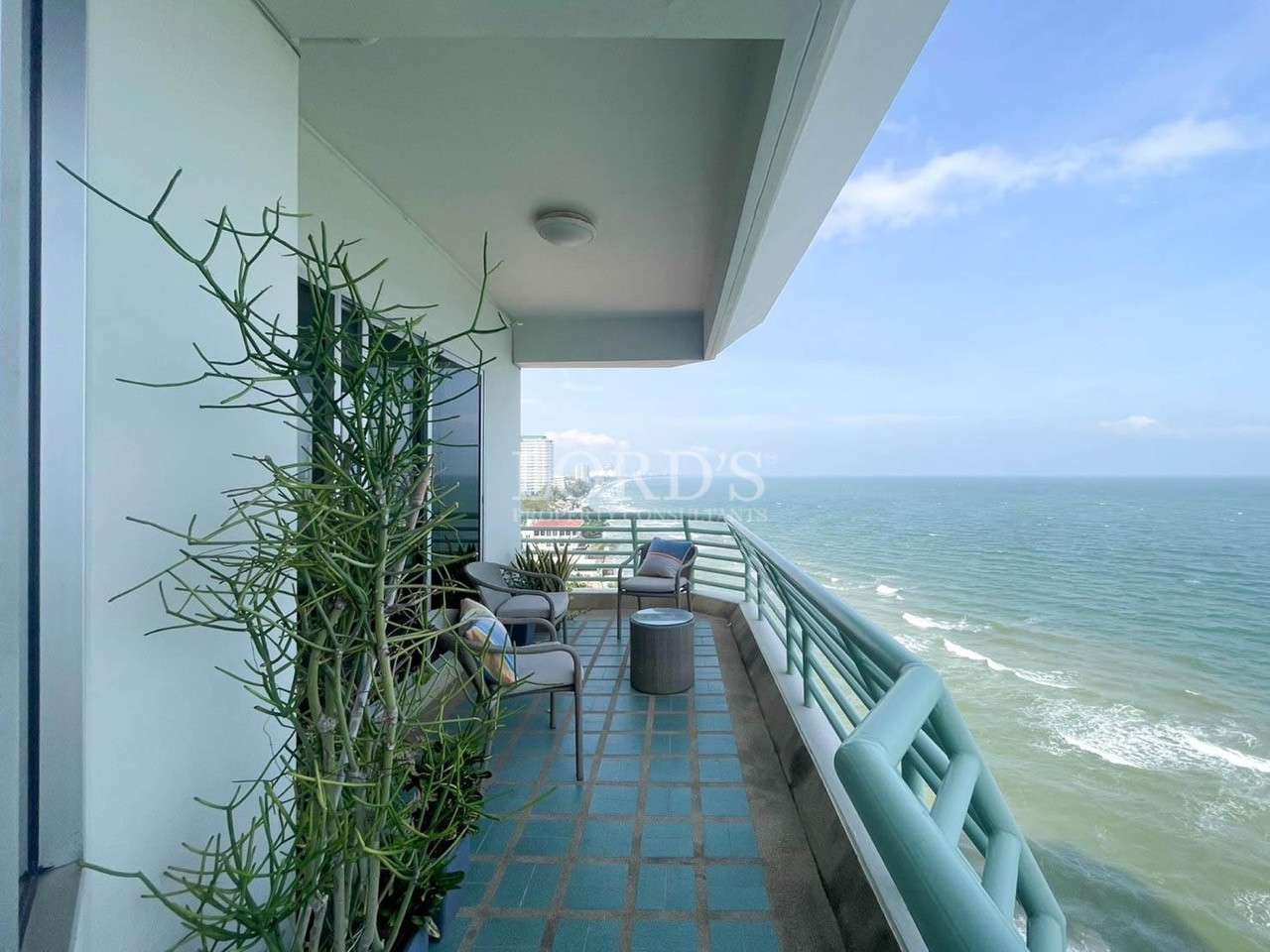 Outdoor balcony with railing and ocean view