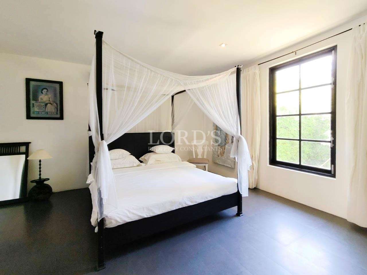Bedroom with canopy bed and modern decor