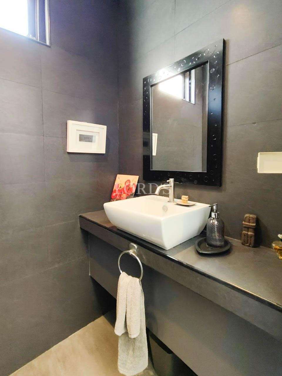 Bathroom with sink and wall mirror