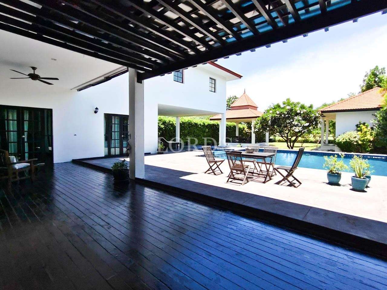 Outdoor deck with dining and pool area