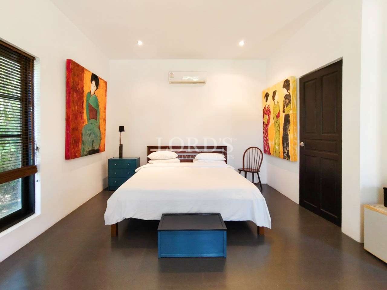 Bedroom with bed and wooden floor