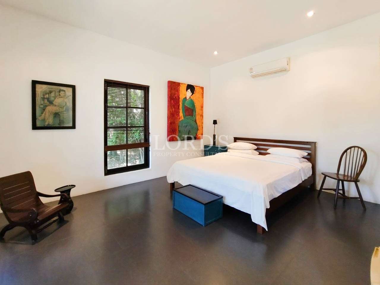 Bedroom with bed and wall art