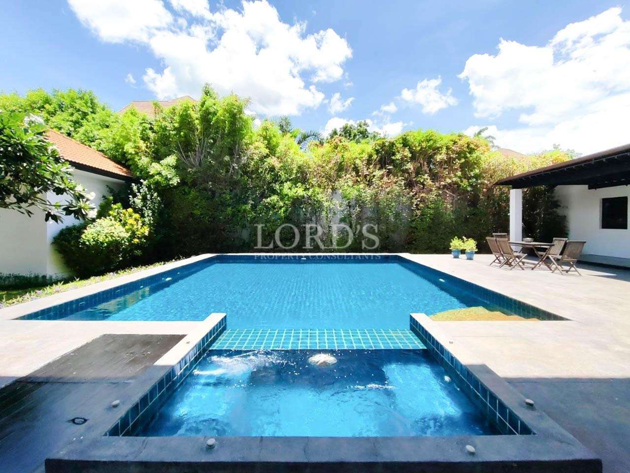 Swimming pool with greenery and blue sky
