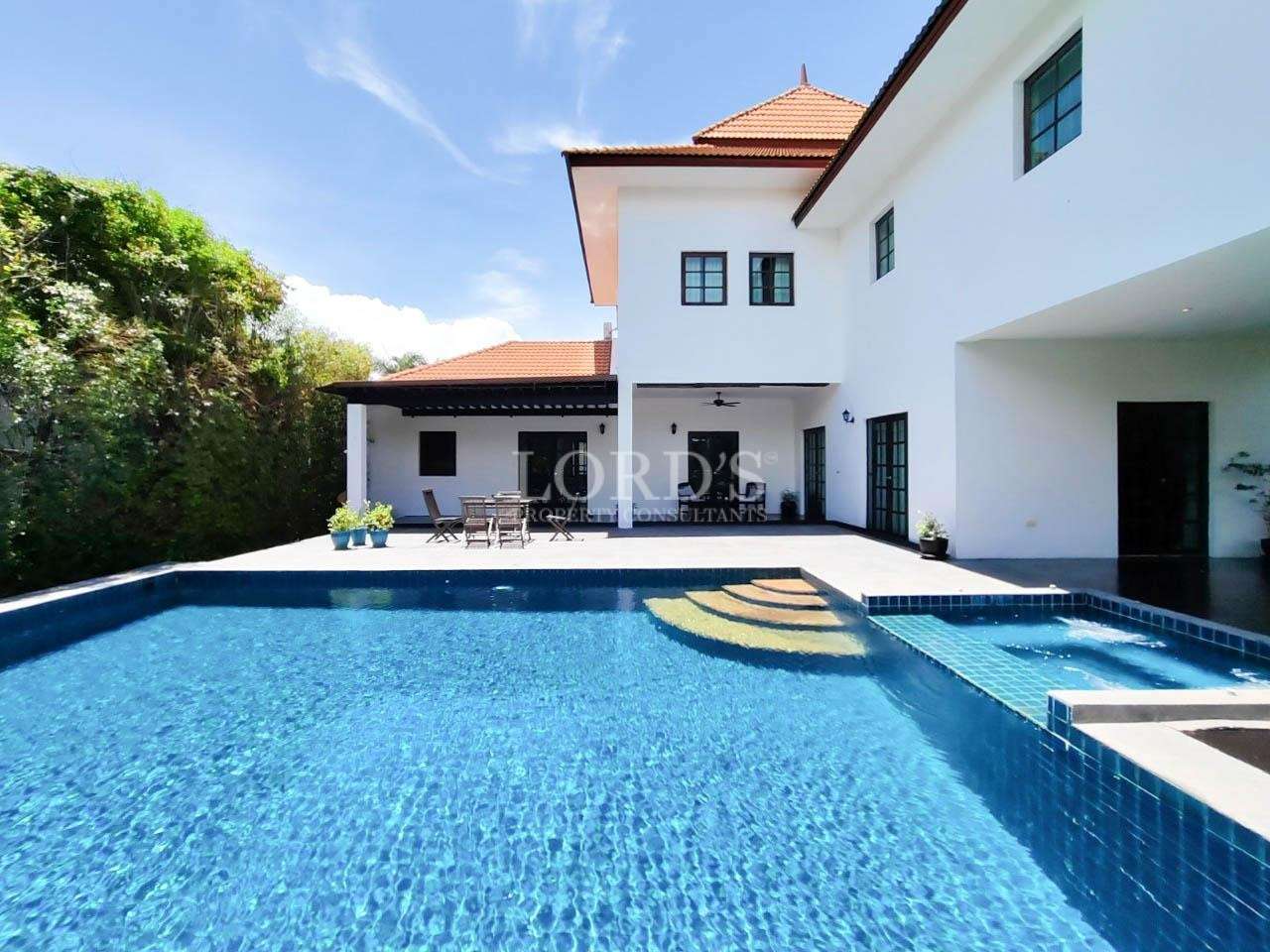 Large villa with swimming pool and blue tiles