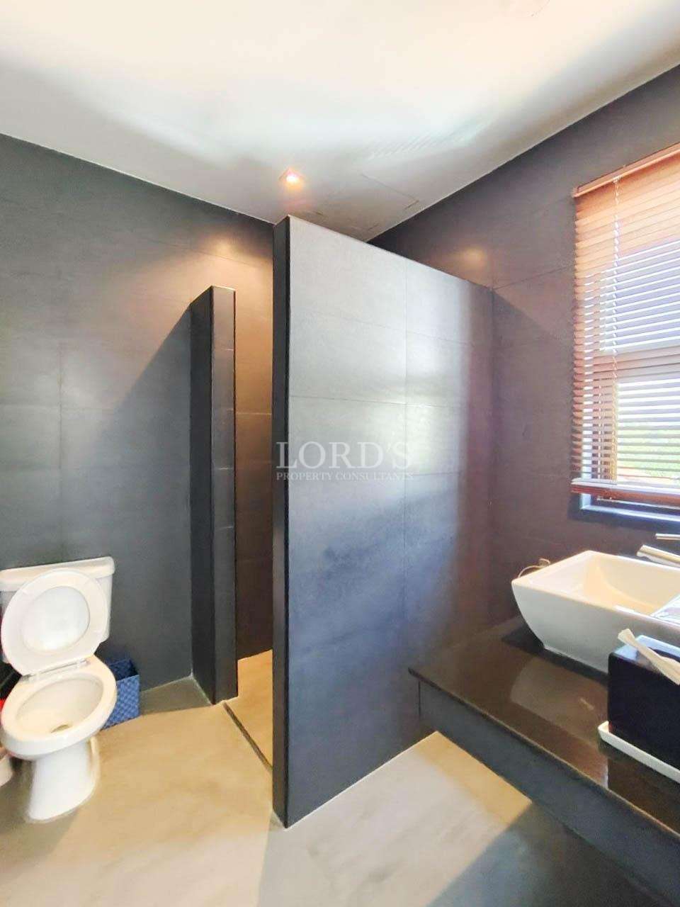 Bathroom with toilet and sink area