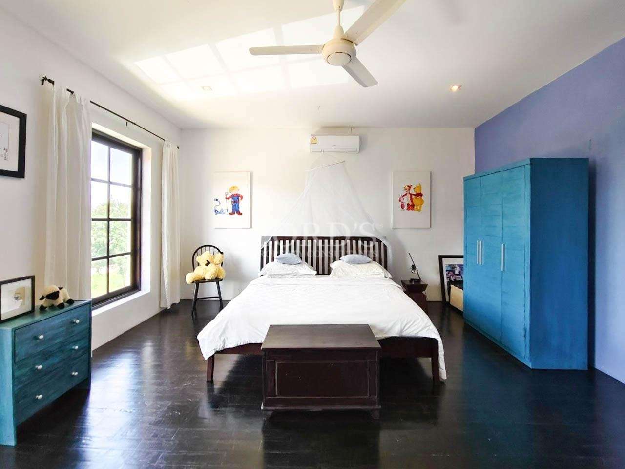 Bedroom with bed and wardrobe