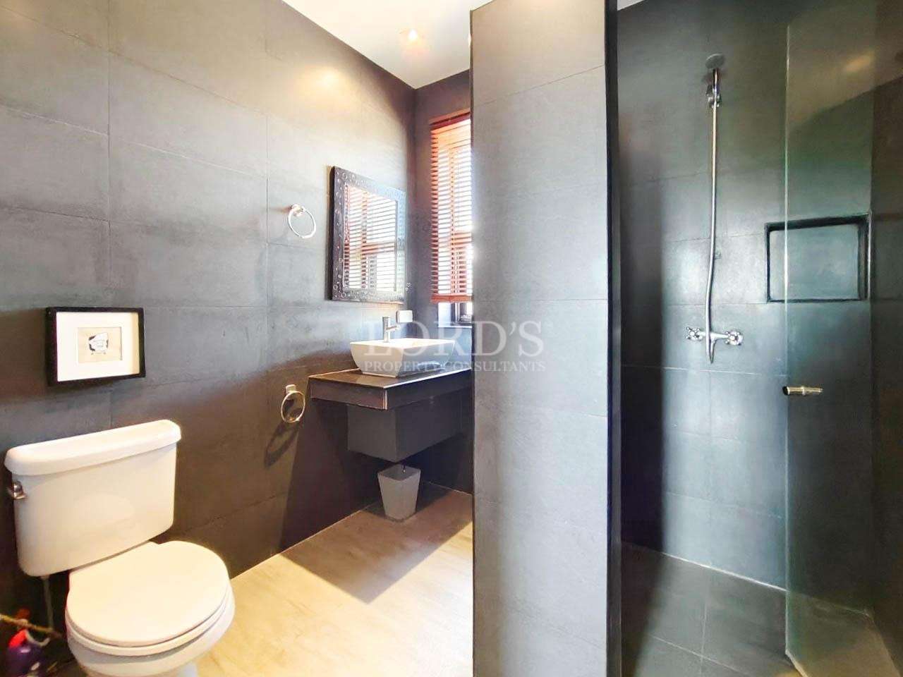 Bathroom with mirror and lighting