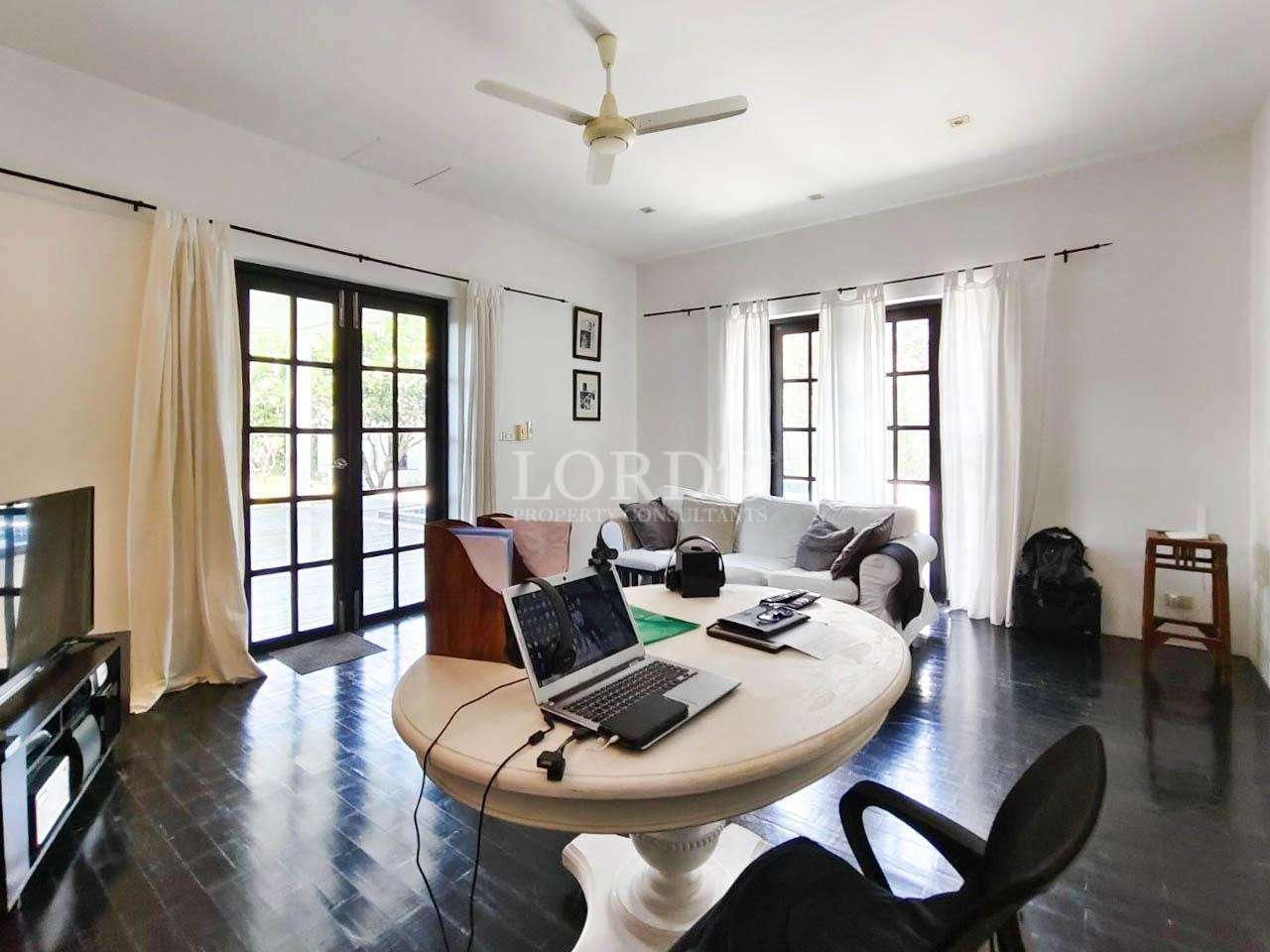 Bright living room with round table and chairs