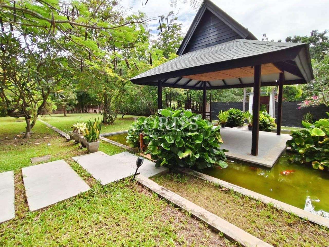 Pavilion surrounded by lush greenery
