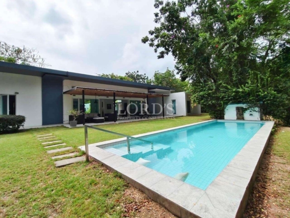 Exterior of villa with pool and lawn