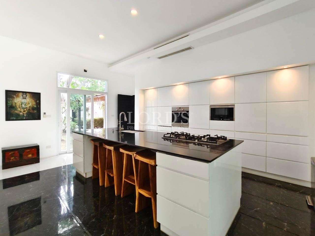 Kitchen bar with stools and modern lighting