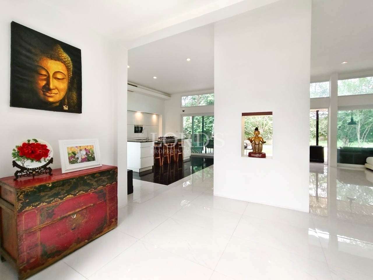 Bright living room with white walls and decor