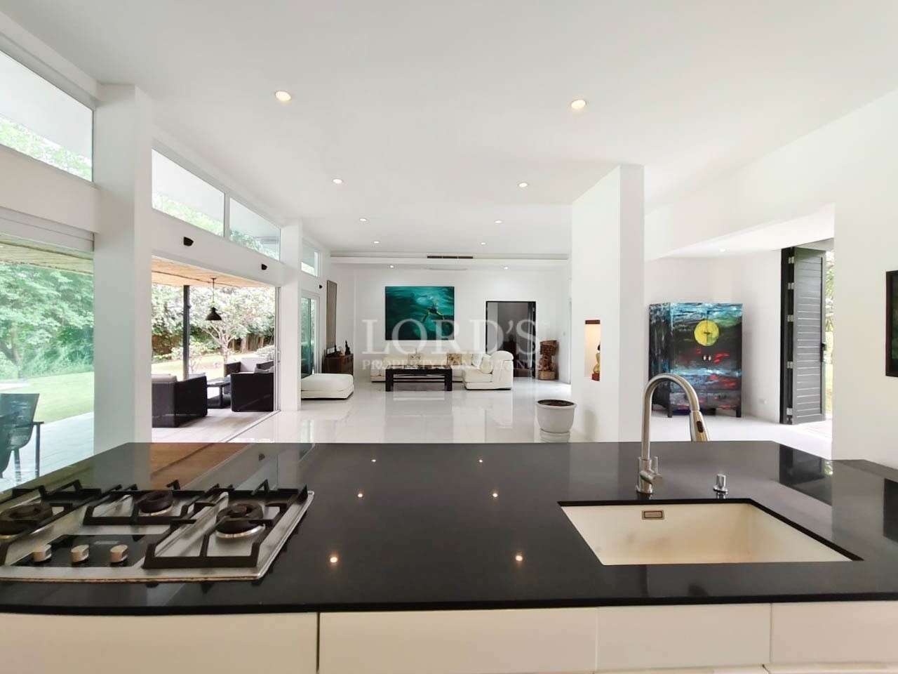 Modern open-plan kitchen with island and living area