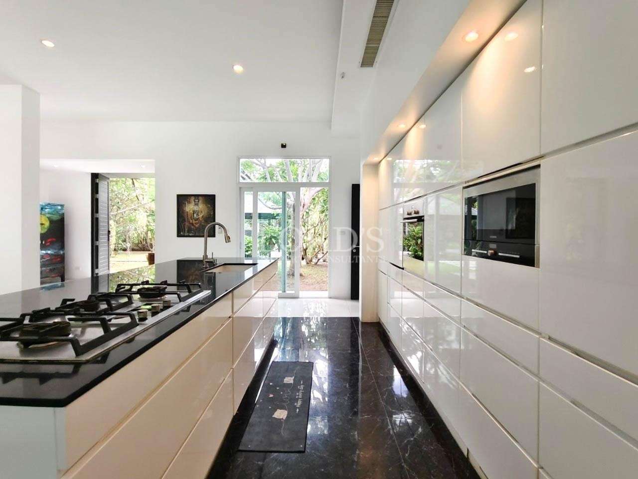 Long kitchen counter with storage and appliances