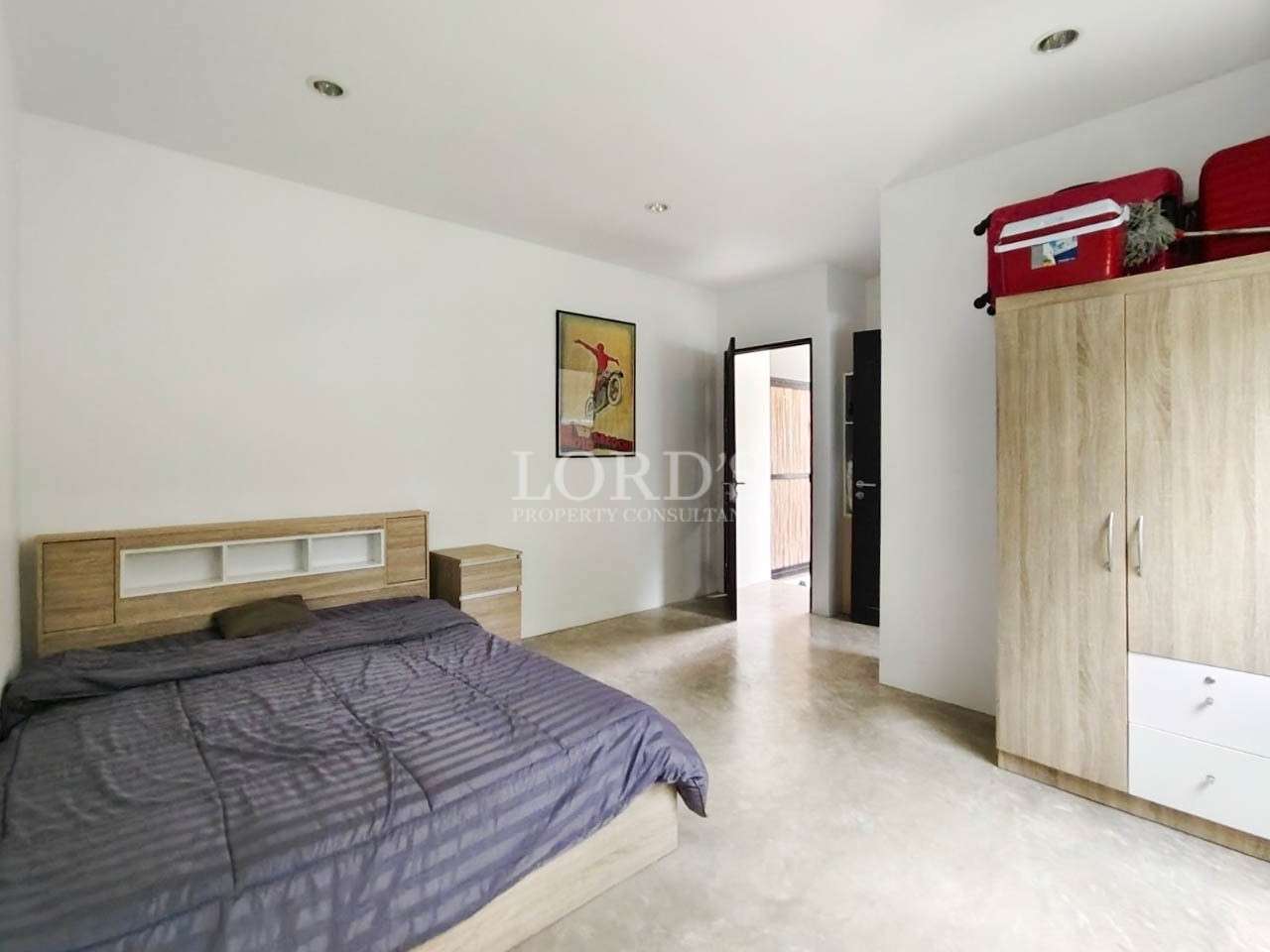 Bedroom with wardrobe and bed