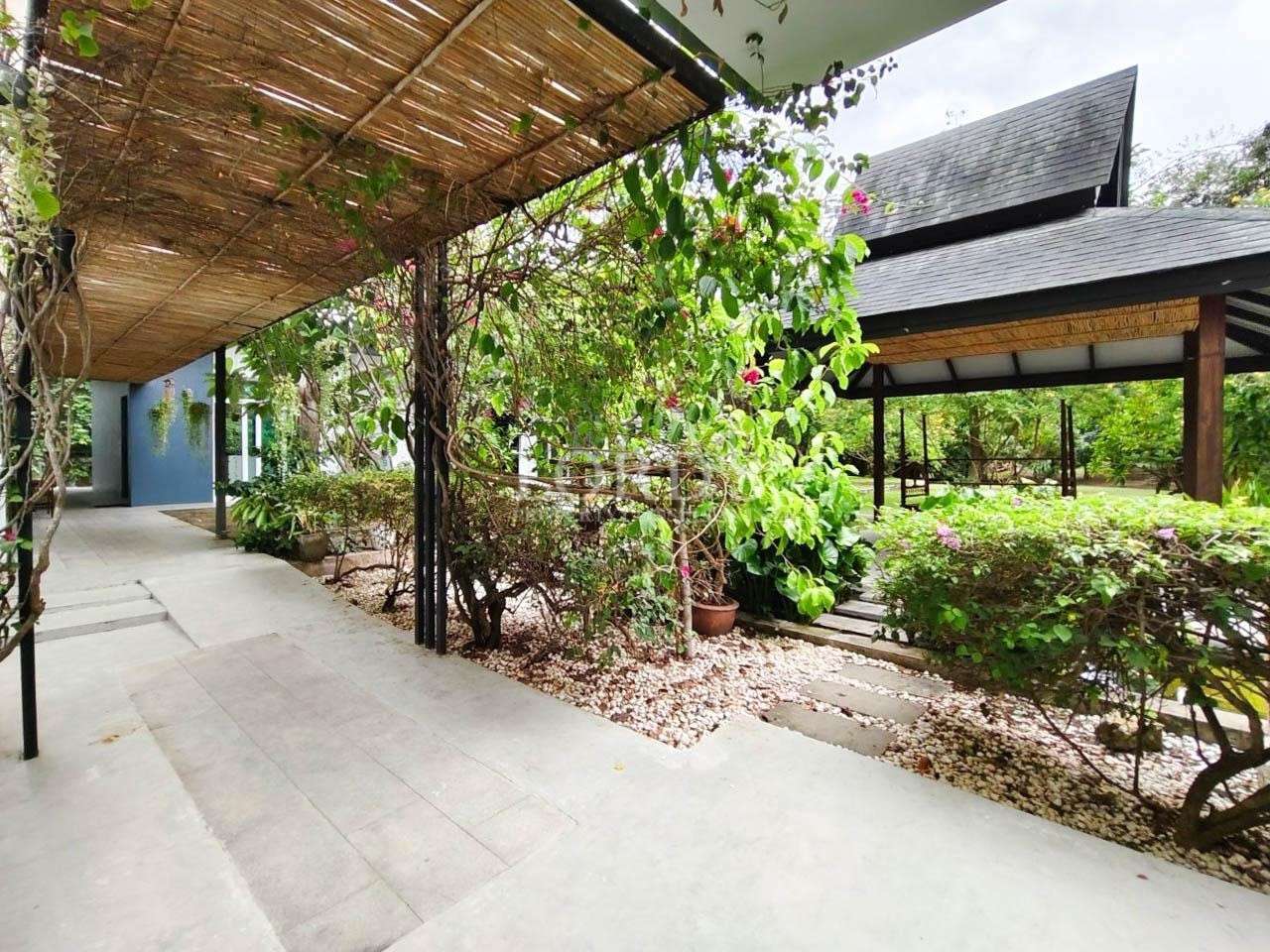 Outdoor patio with garden and roof cover