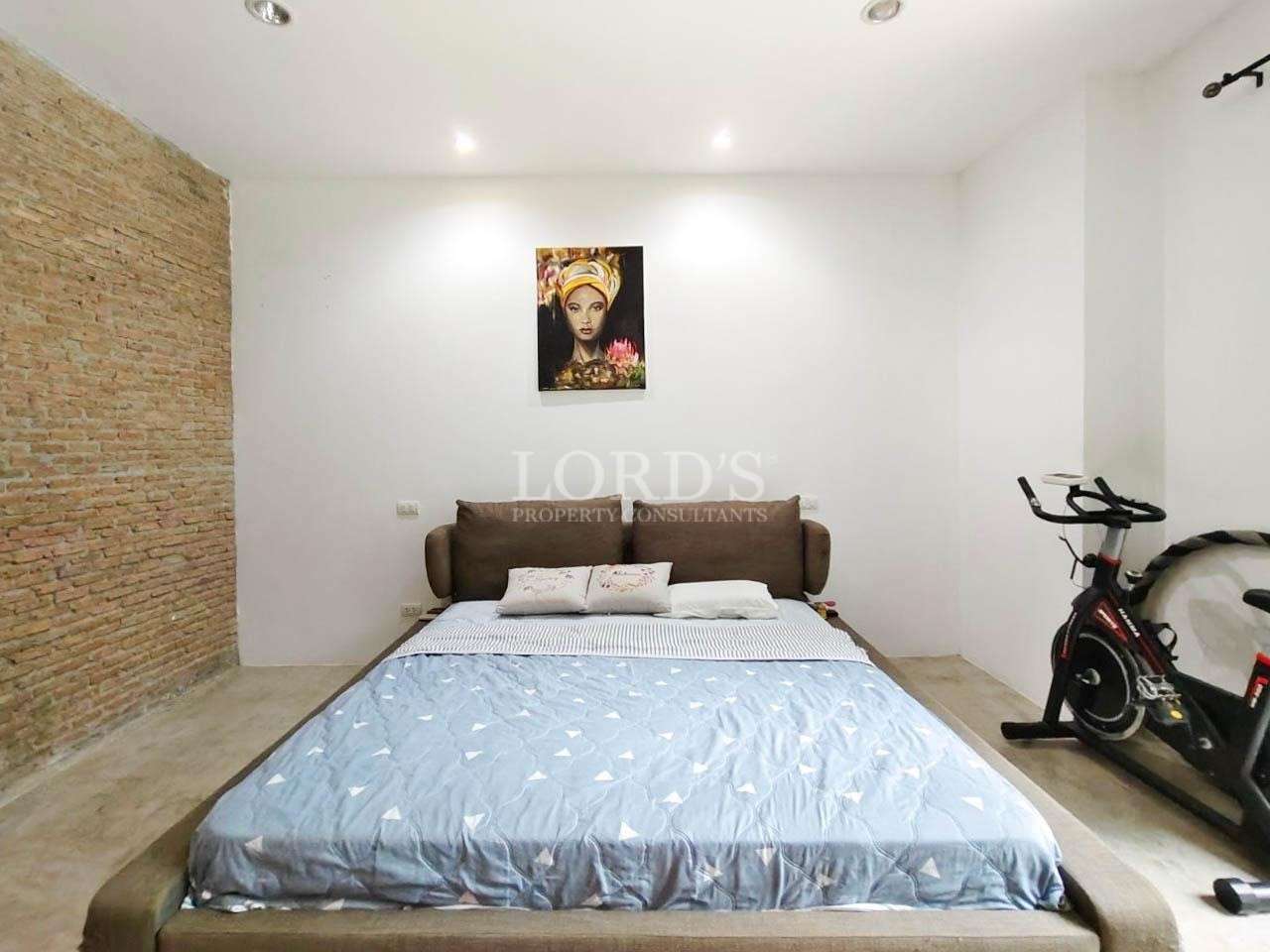 Bedroom with bed and wall art