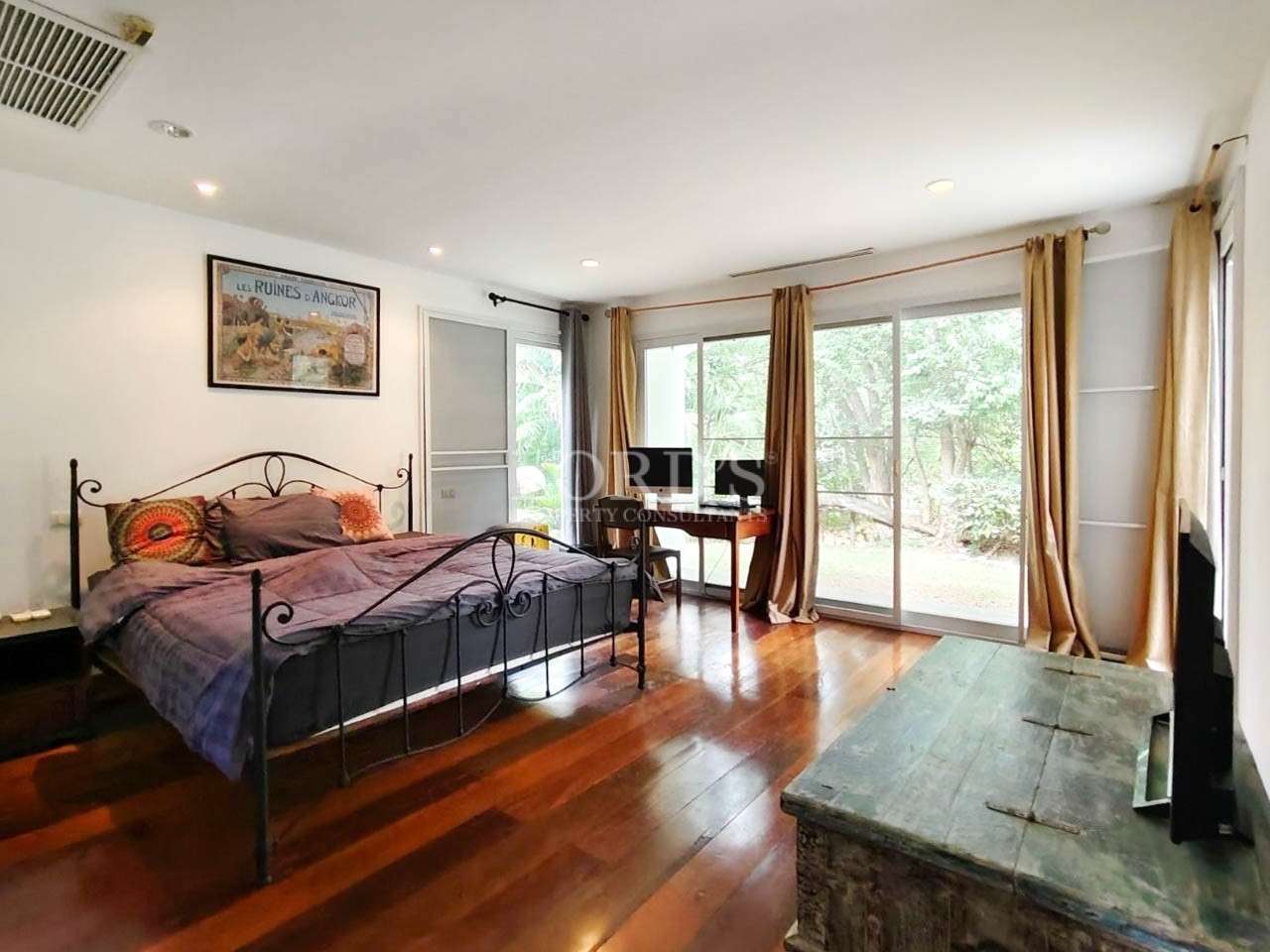 Spacious bedroom with balcony access