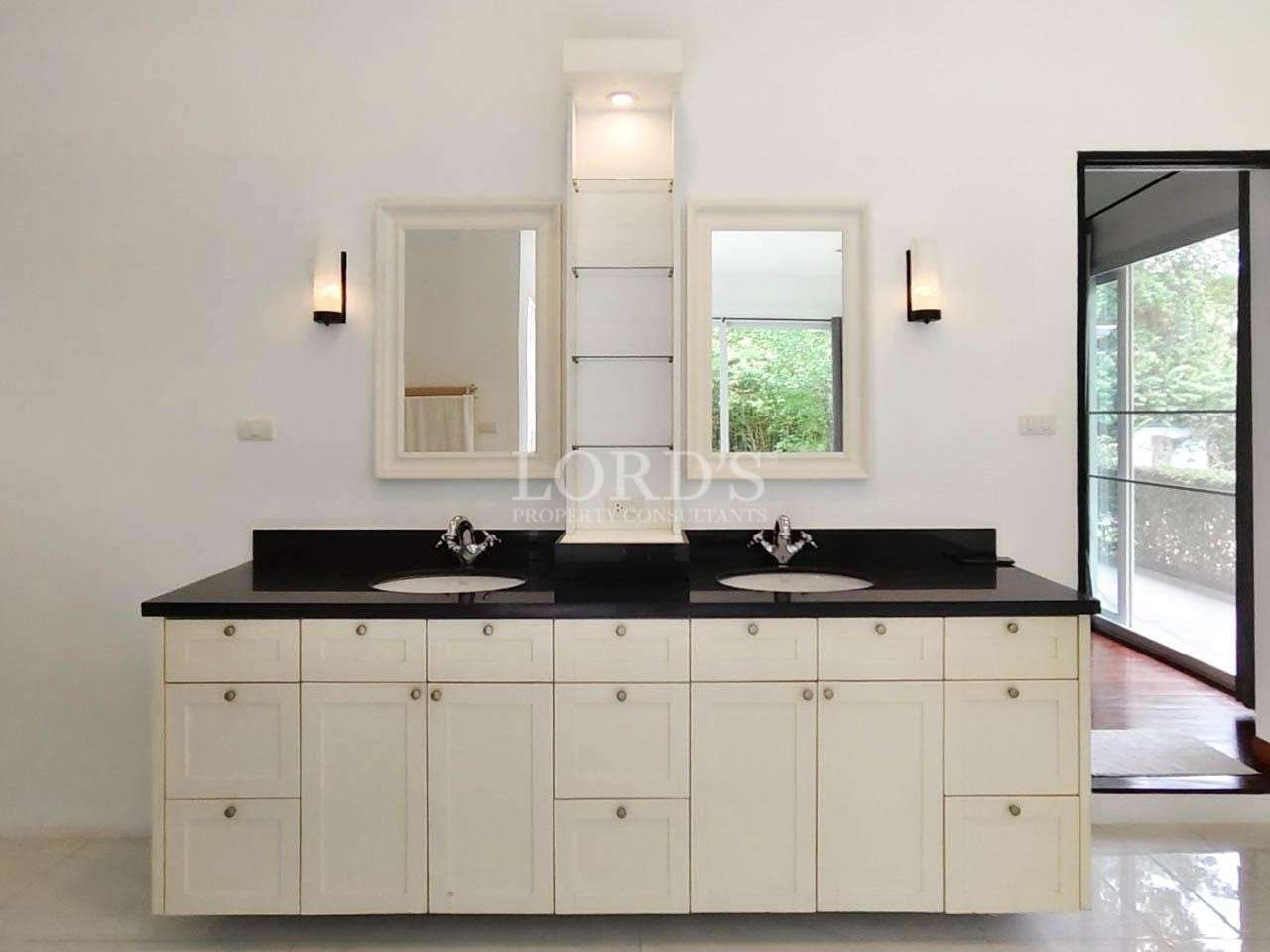 Minimal outdoor shower area with plants