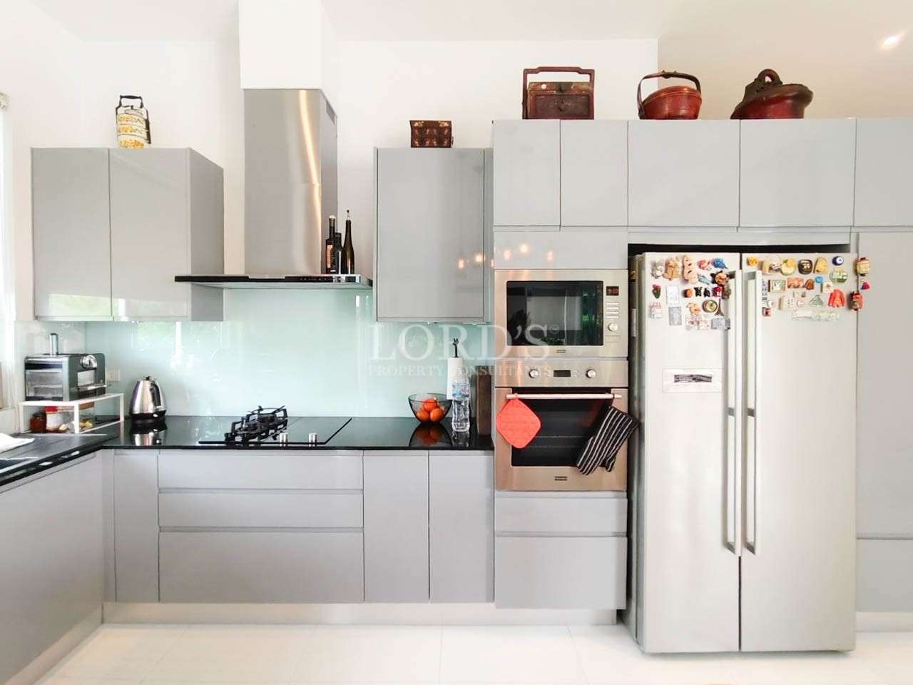 Modern kitchen with white cabinets and appliances