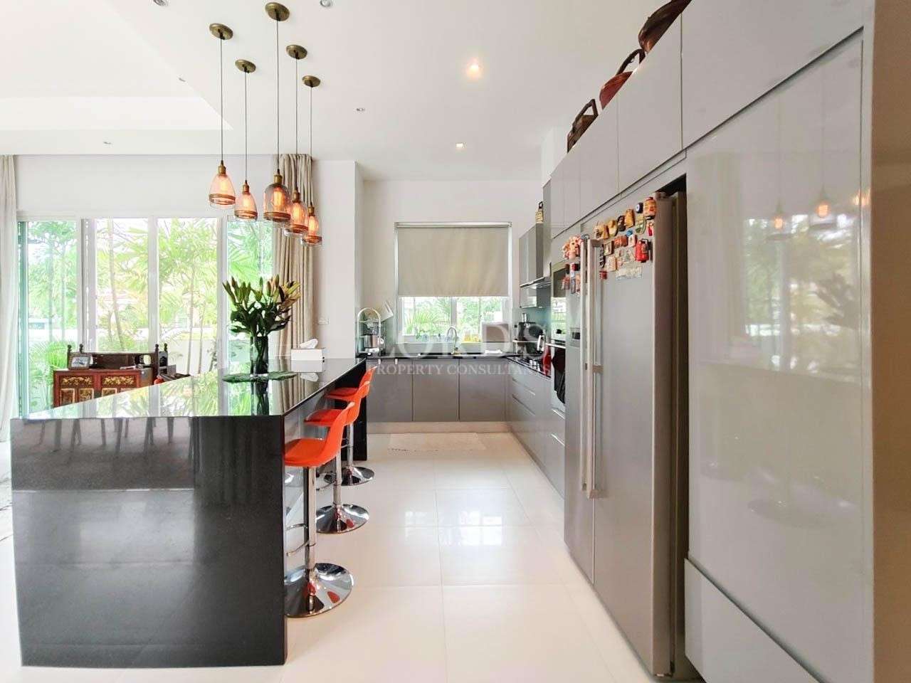 Kitchen with island and bar stools
