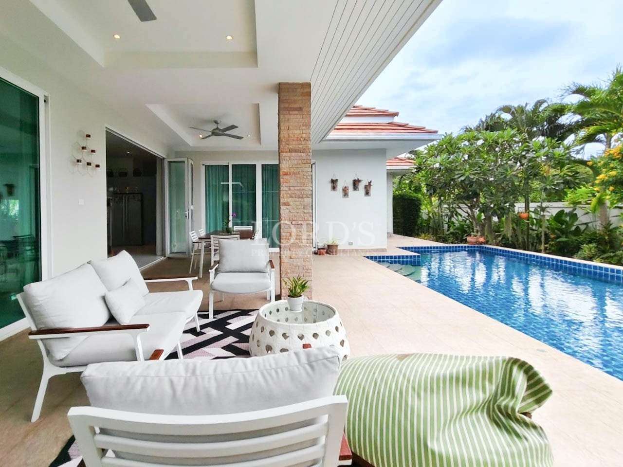 Outdoor patio seating near pool
