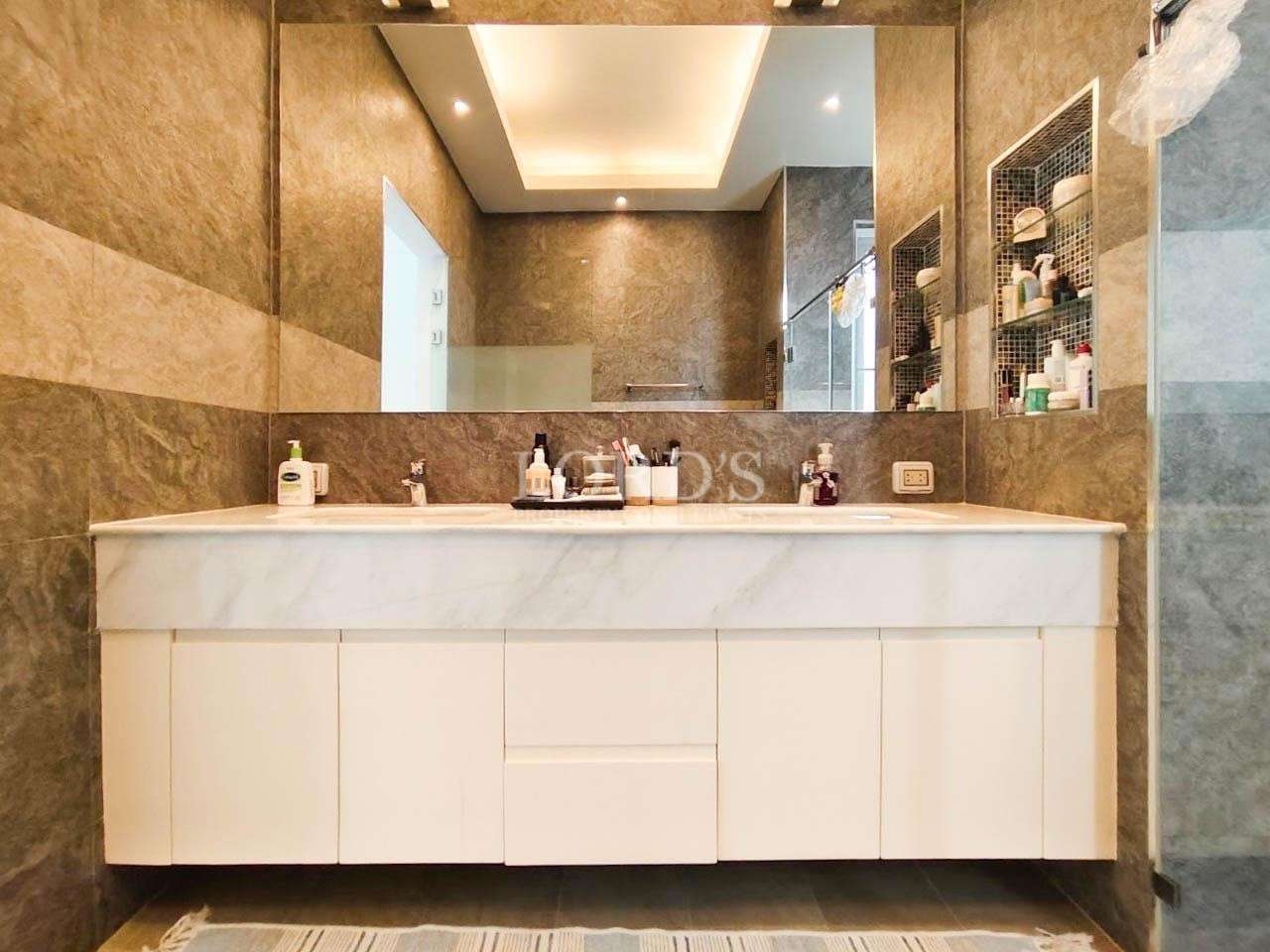 Bedroom with bed and red rug