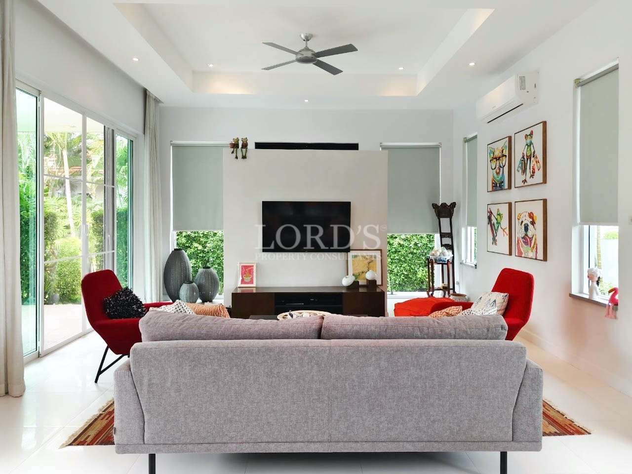 Living room with TV and ceiling fan