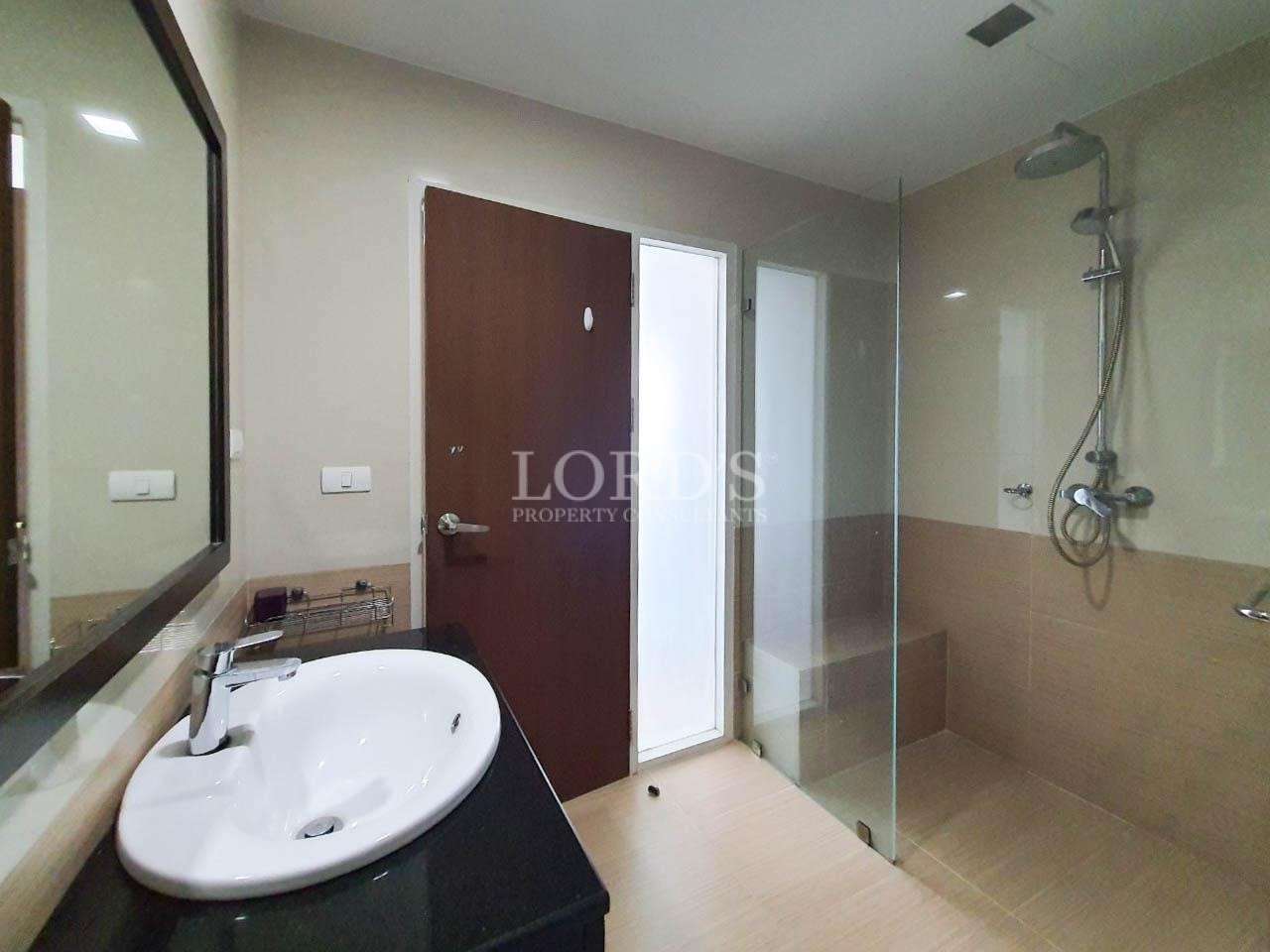 Bathroom with sink and glass shower