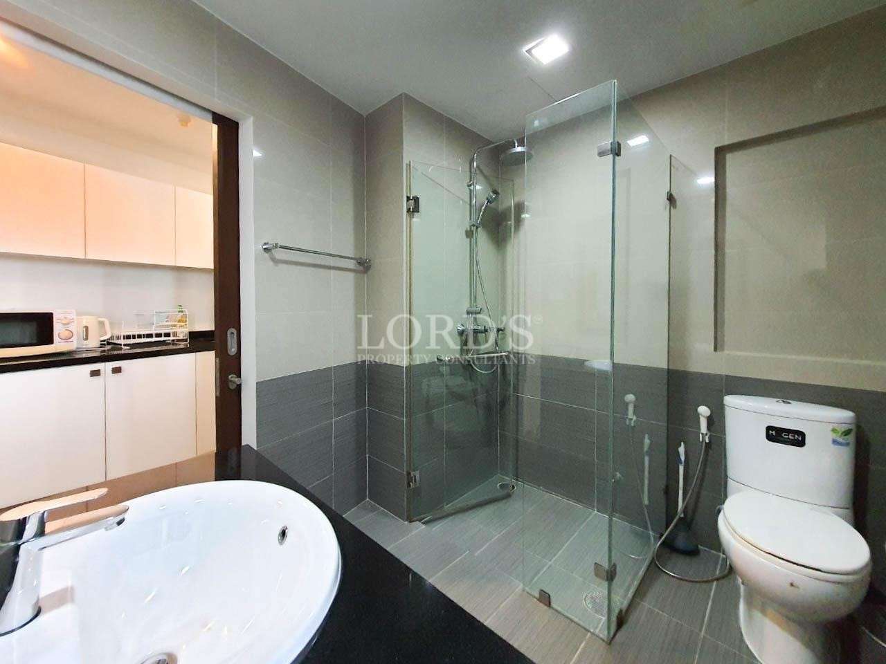 Bathroom with shower and glass partition