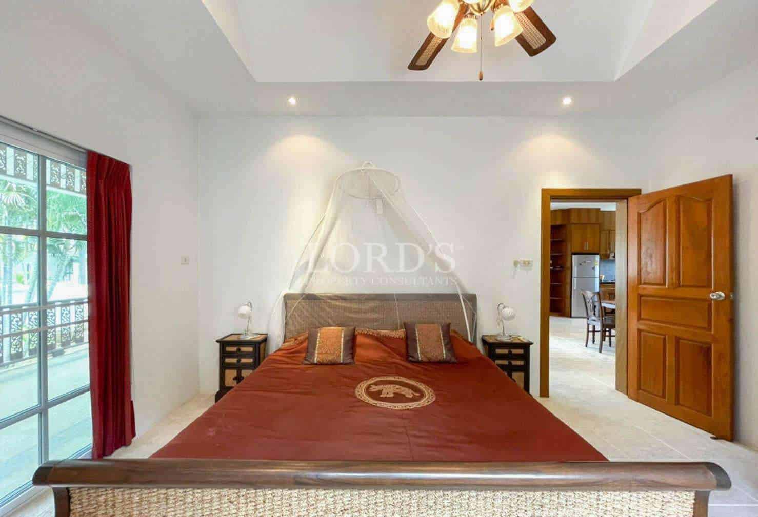 Bedroom with red carpet and decor