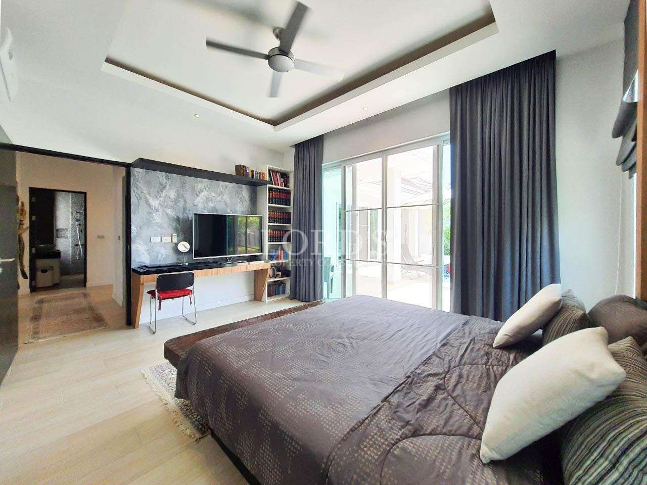 Bedroom with bed and TV setup