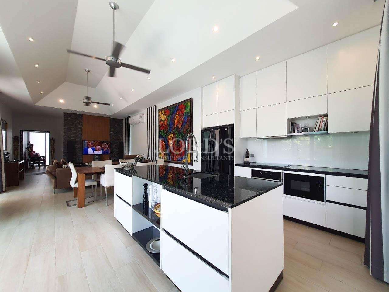 Kitchen with long counter and modern appliances