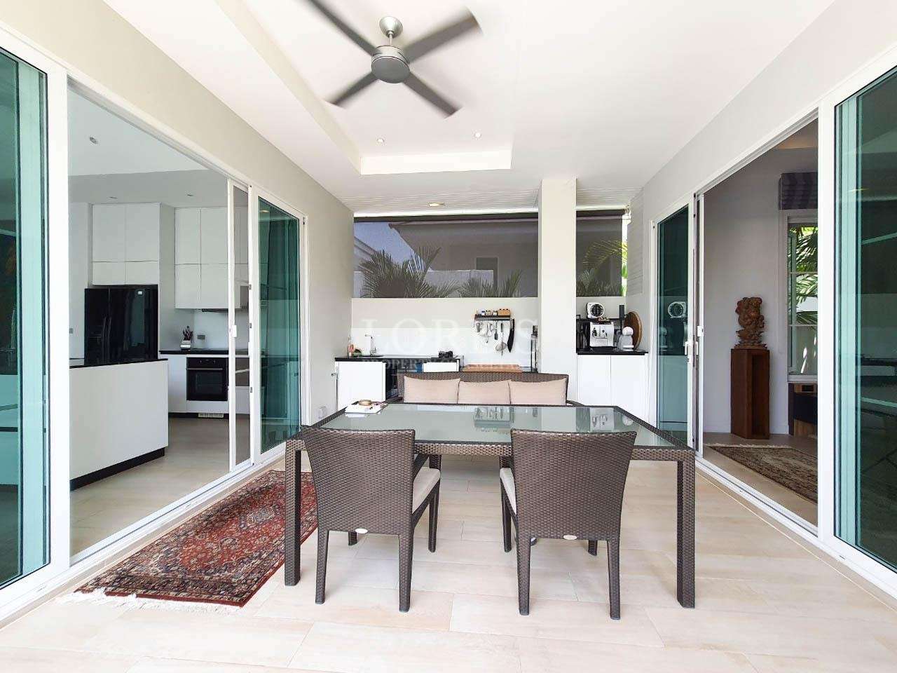 Dining area with table, chairs, and ceiling fan