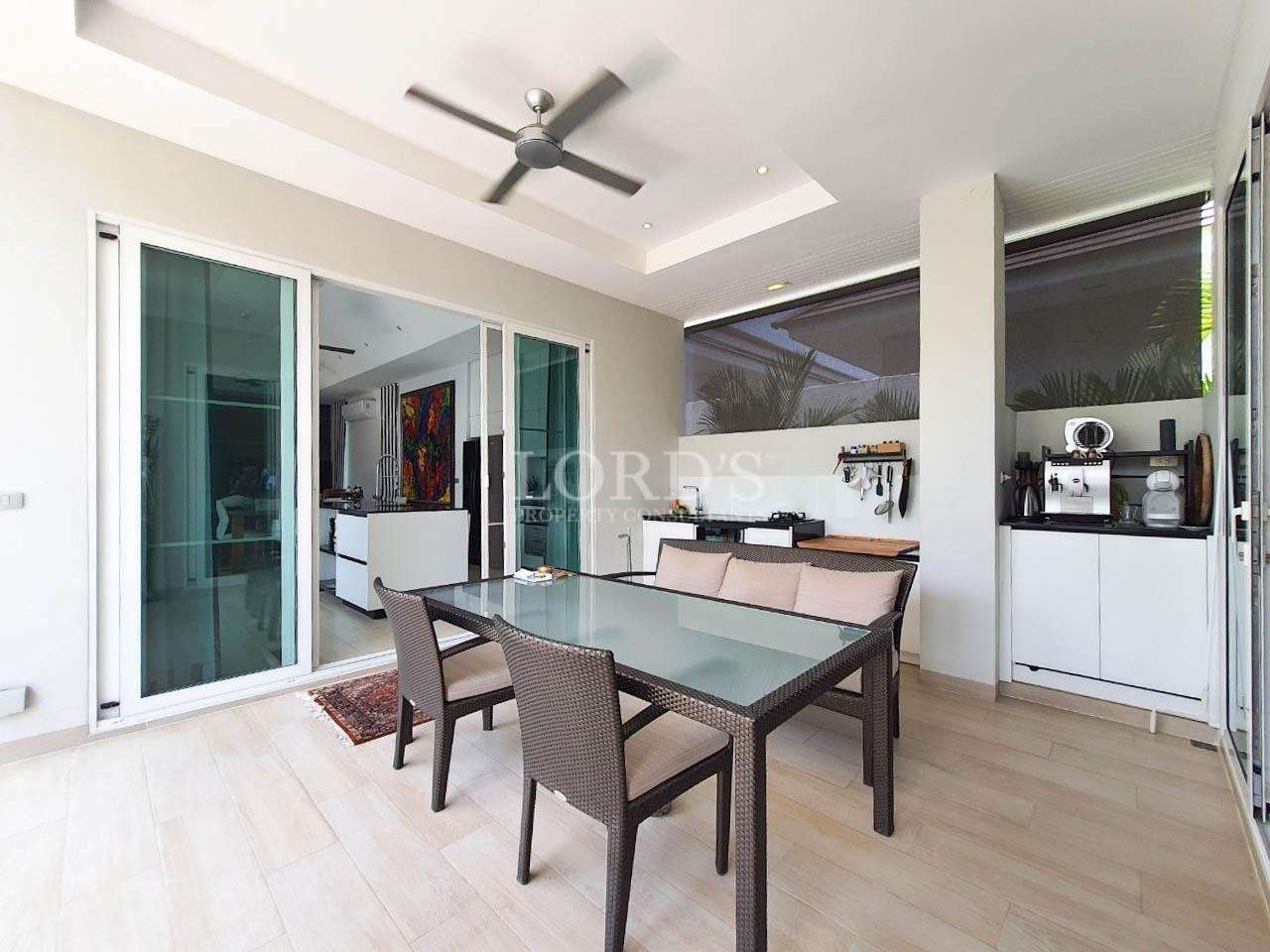 Dining area with table and kitchen view