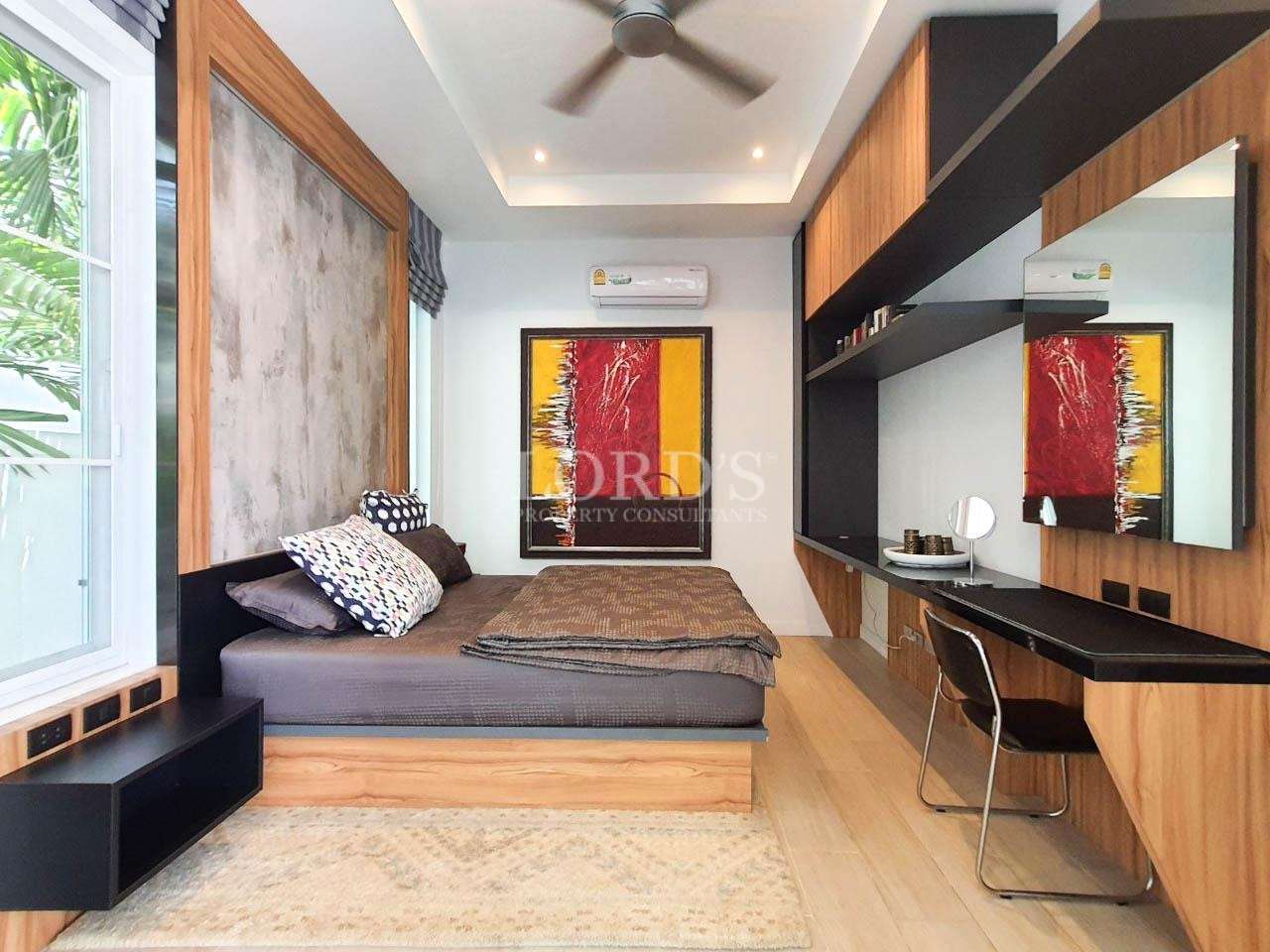 Bedroom with bed and decorative wall art