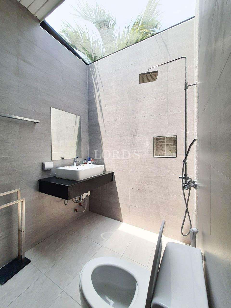 Bathroom with wall-mounted sink and shower