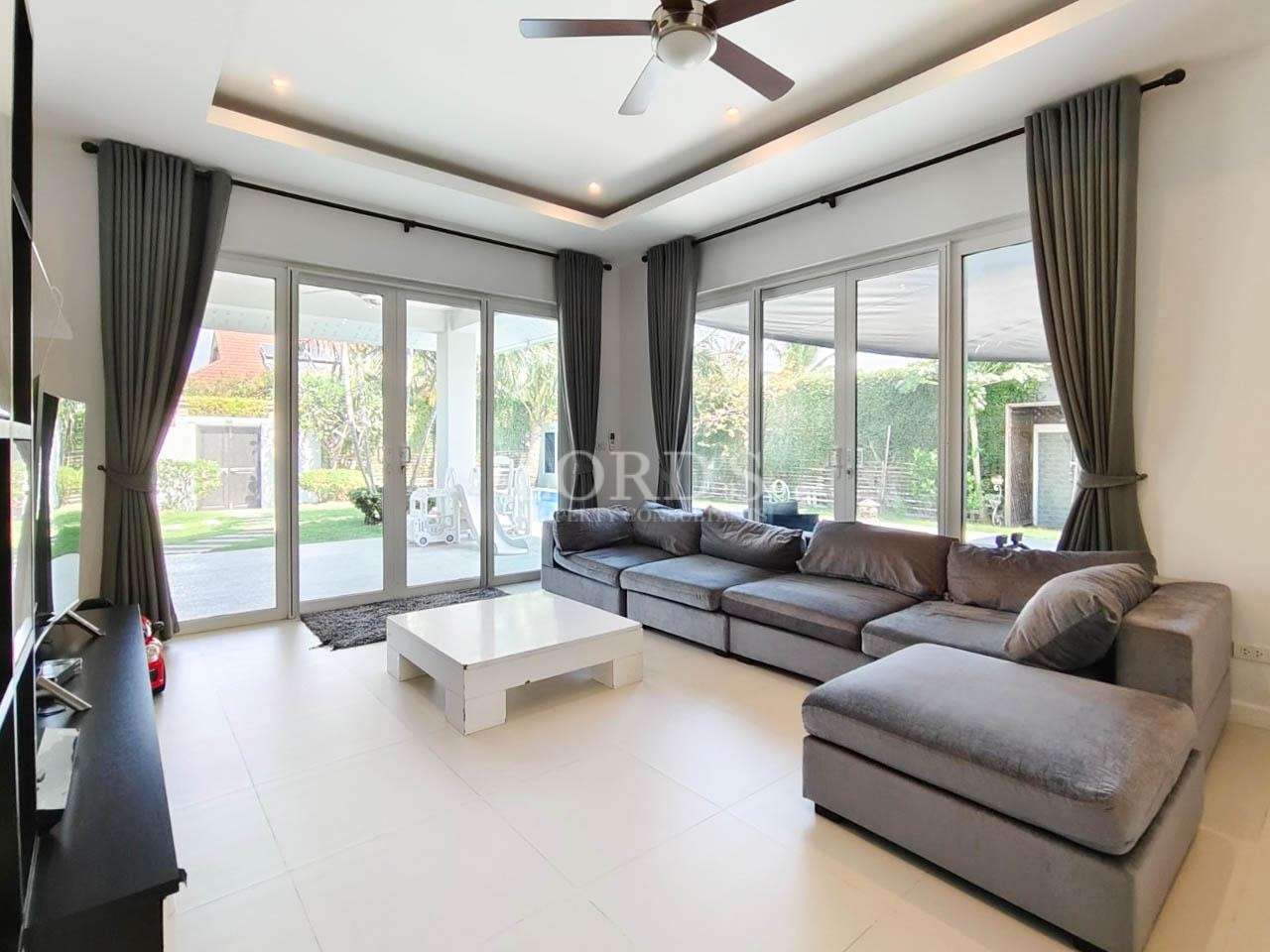 Living room with sectional sofa and TV unit