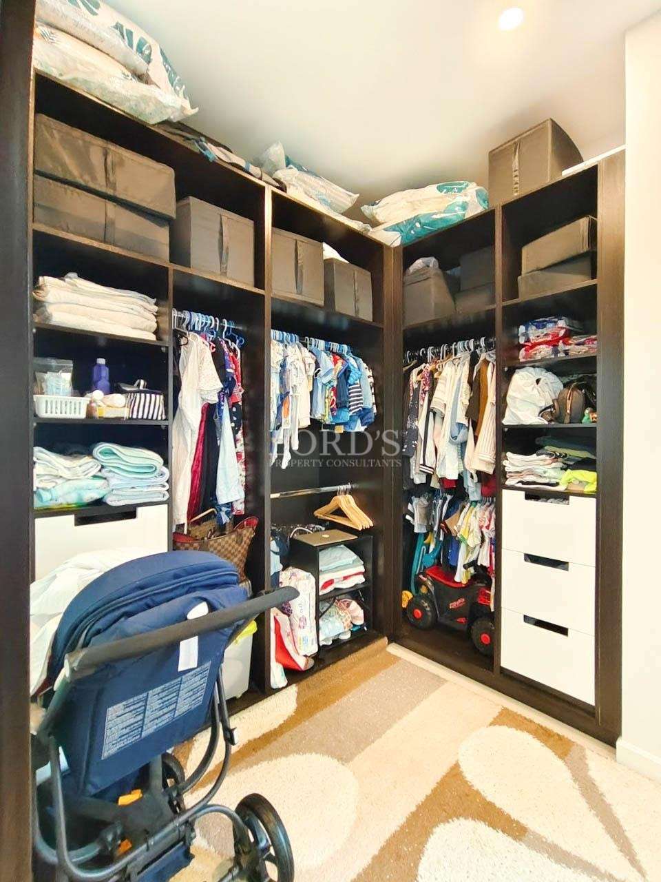 Large walk-in wardrobe with clothing storage
